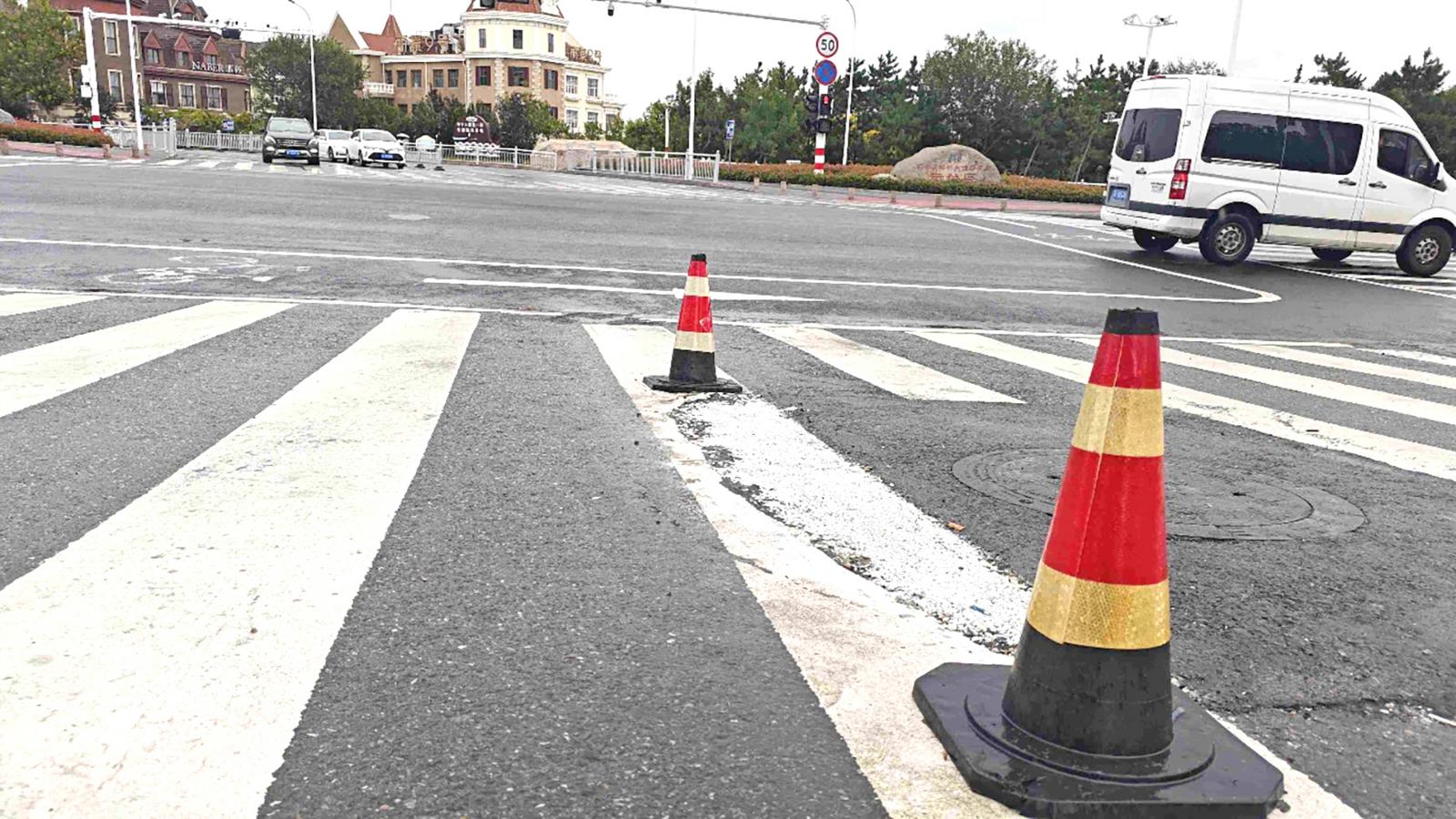 天成北街路口破损路面修好了